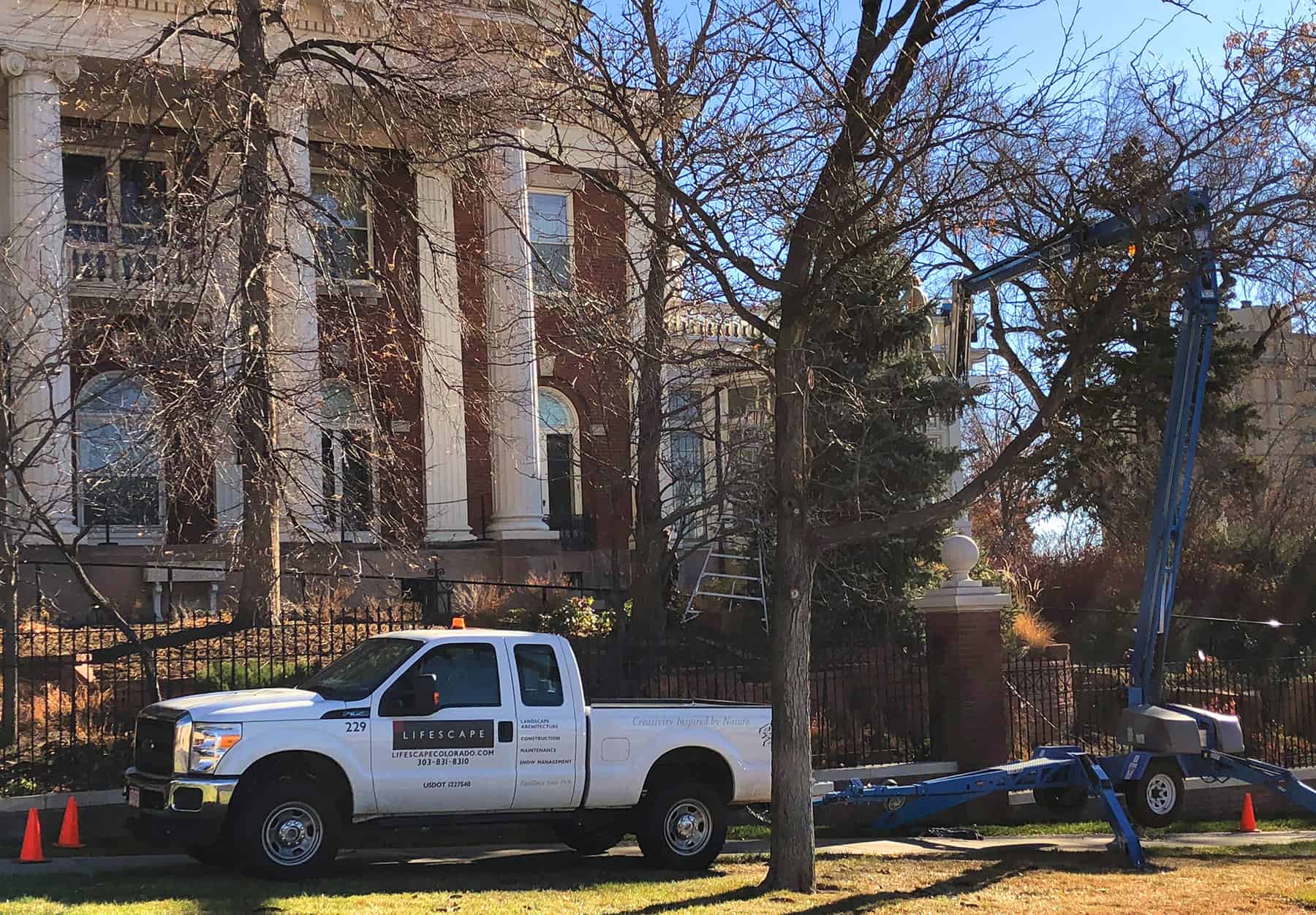 Crew installing holiday lights at the Colorado Governor's Mansion