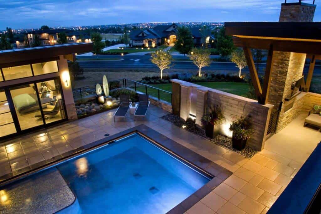aerial view of modern pool and patio at night