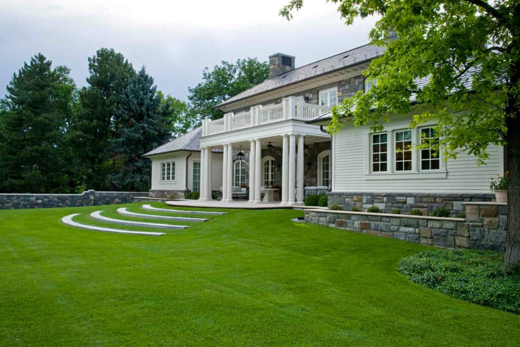 large white estate home and lawn