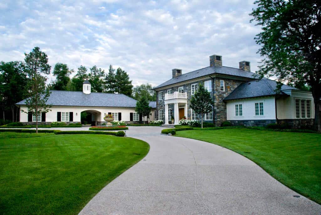 large white estate home and driveway