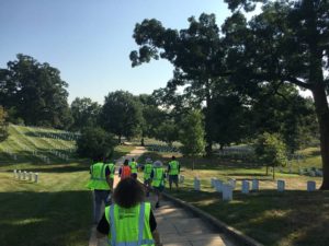 volunteers walking in cemetery