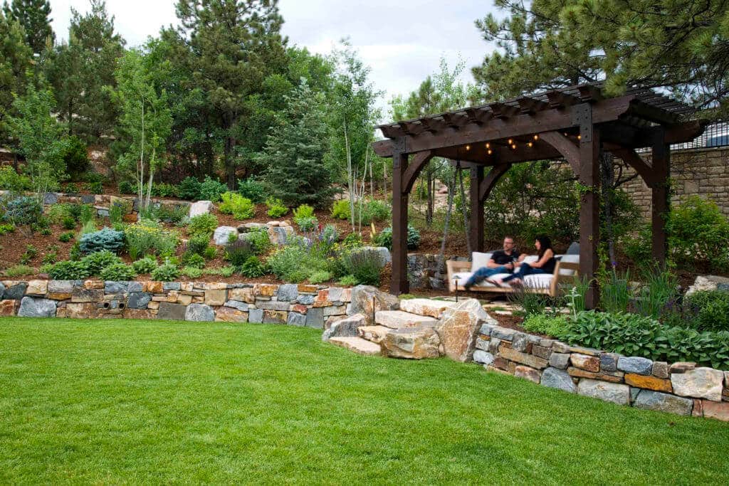 couple relaxing on pergola swing