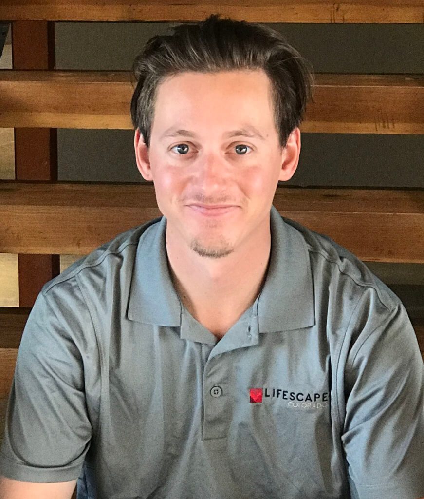 smiling man wearing Lifescape Colorado polo shirt