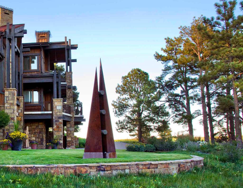 rustic estate exterior with modern metal sculpture