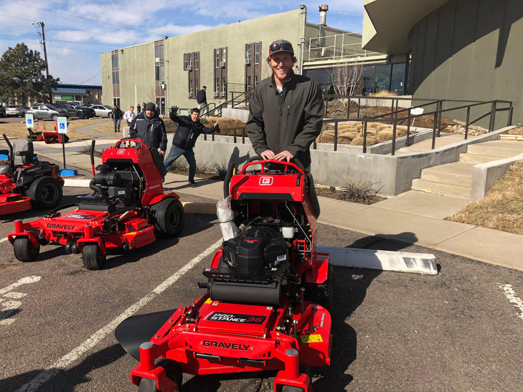 smiling man with red Gravely commercial mower
