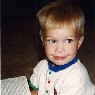 close-up portrait of a toddler with light hair and blue eyes