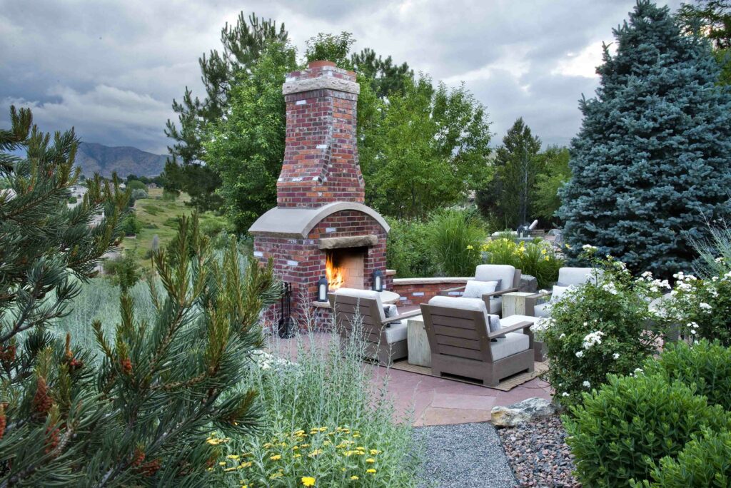 brick fireplace warms mountain patio