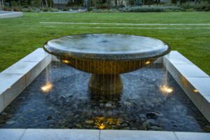 illuminated bowl fountain in garden