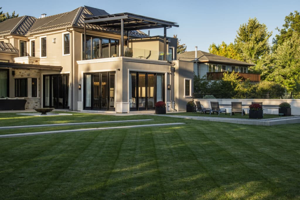 modern estate features manicured lawn