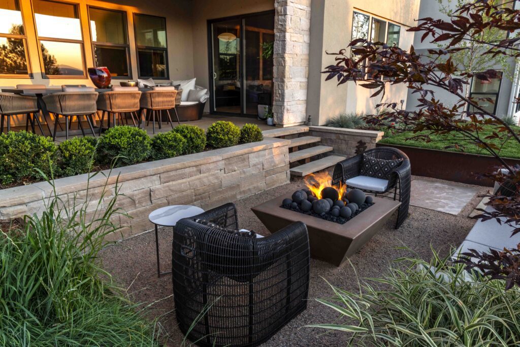 warm fire pit glows on patio