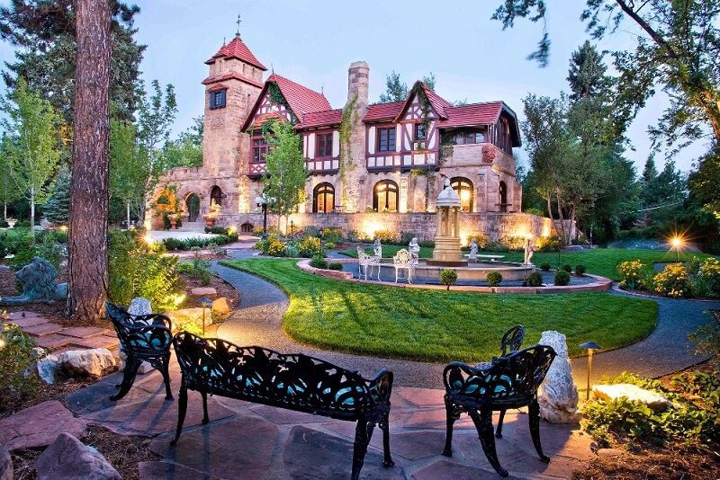 elegant estate features manicured gardens