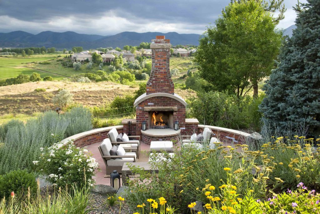 brick fireplace overlooks scenic mountain valley