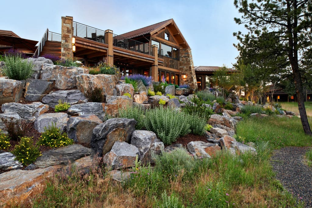 large boulders frame rustic mountain home