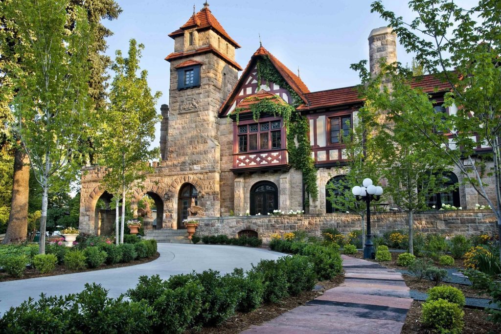 stone manor features lush green landscaping