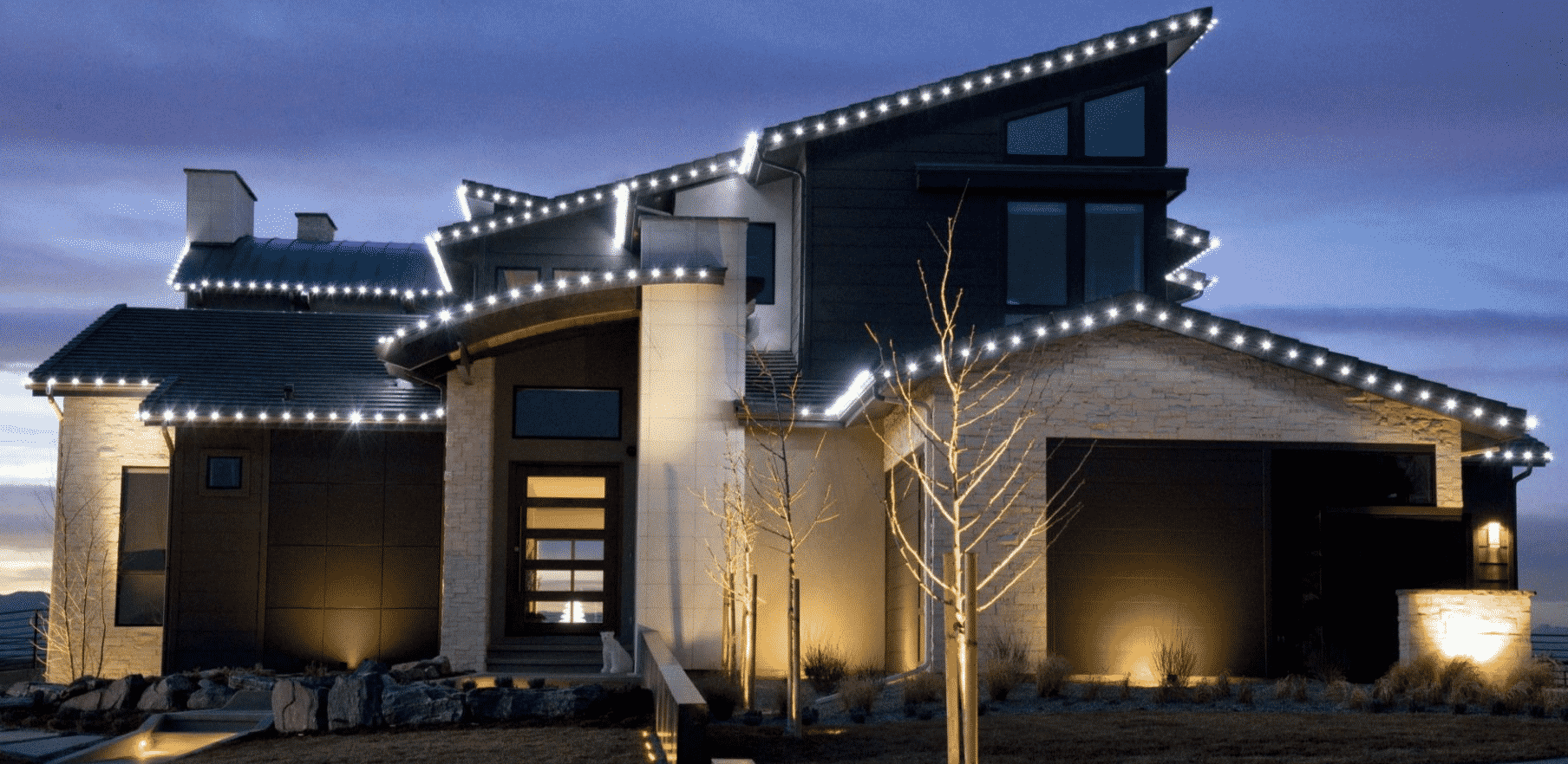white lights outline modern house roof