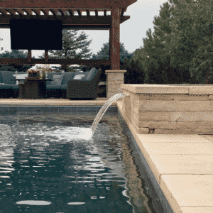 water stream flows into pool