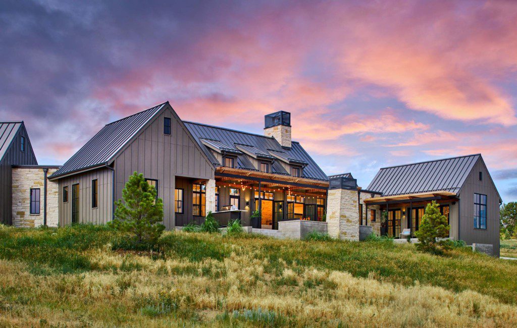 modern farmhouses under colorful sunset