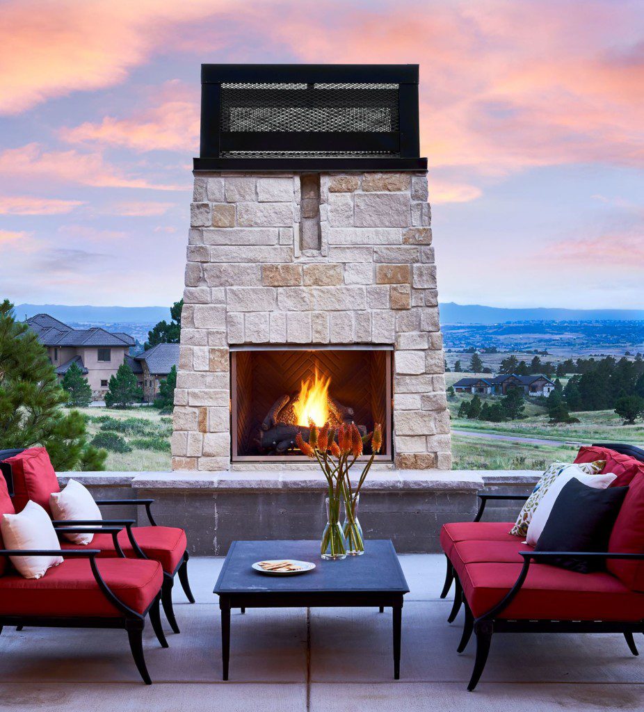 tall stone fireplace outdoors