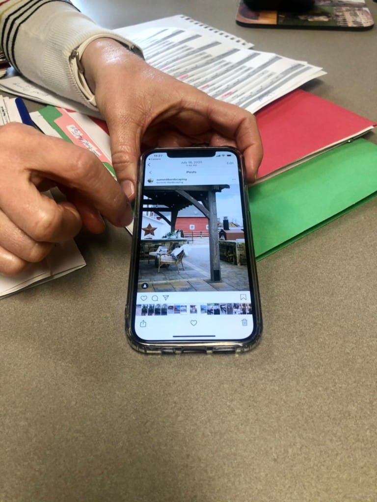 person viewing photos on phone
