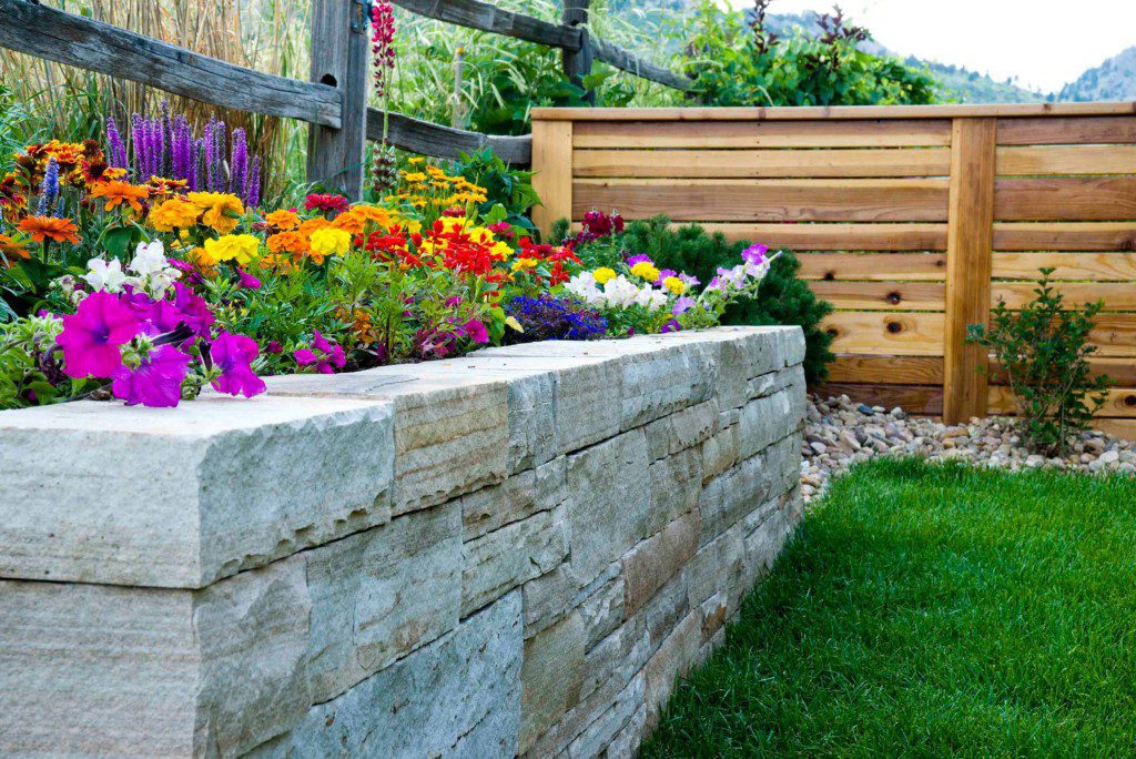 bright flowers in stone planter